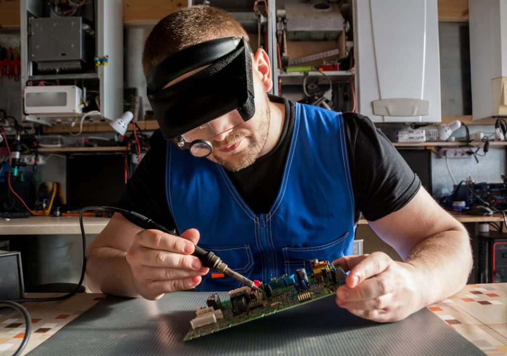 Engineer repairs electronic board for gas and electric heating boilersю More of my photos and videos Adobe Stock:http://bit.ly/3RqlciK More of my photos and videos Shutterstock: https://www.shutterstock.com/g/ALEKSANDRBERDYUGIN My email: bermix999@gmail.com